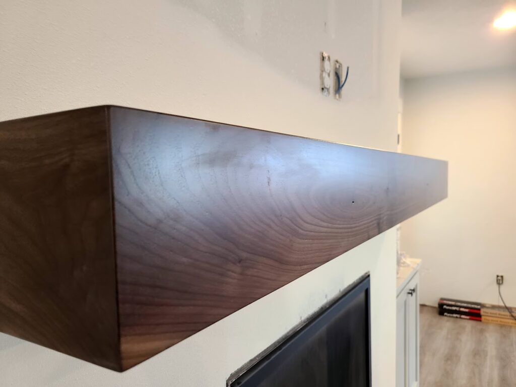 custom fireplace mantel with dark wood