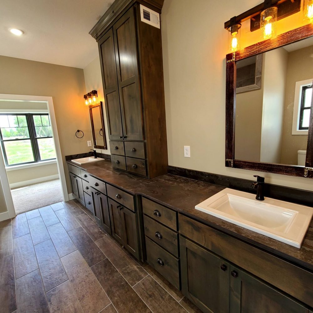 bathroom with dark brown cabinets